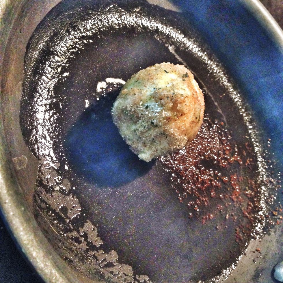 Roll egg around hot oil until bread crumbs look toasty.