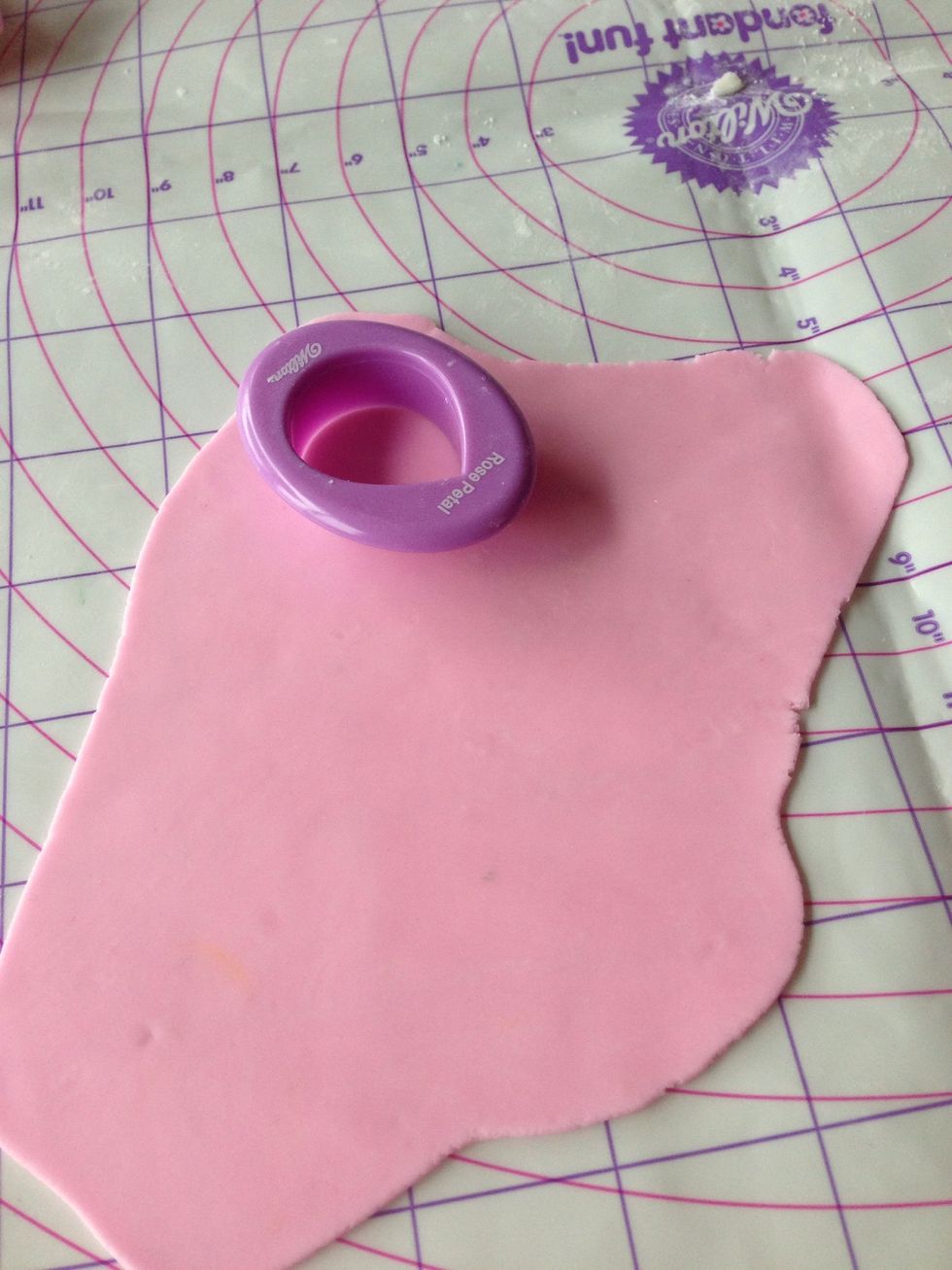 Roll fondant and cut with petal cutter