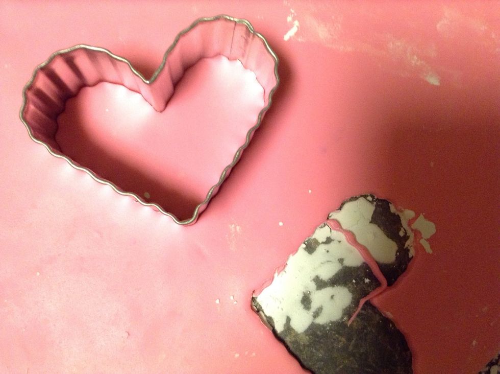 Roll fondant out with a powdered sugar dusted rolling pin, or wine bottle if you don't have a pin! Use cookie cutters to make shapes, or mold it with your hands.