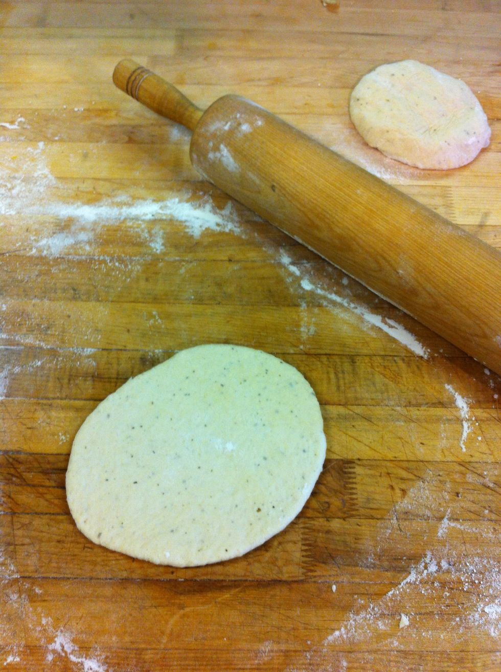 Roll from the centre out up down and side to side. Flip the dough when it springs back too much and make sure there's some flour on both sides to prevent sticking.