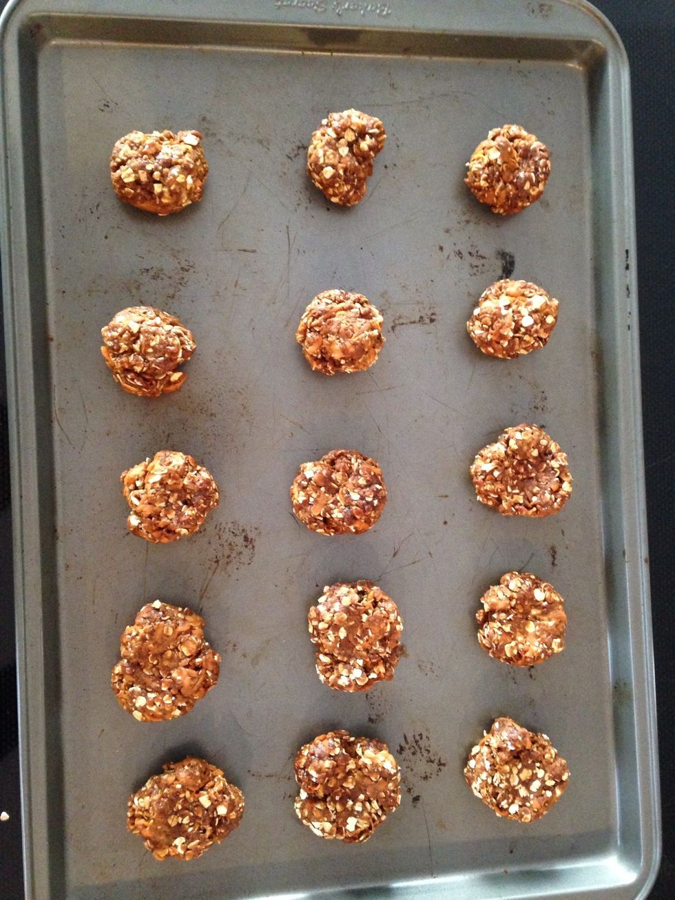 Roll into 1 1/2 inch balls and place on cookie sheet. Use spoon to flatten treats (optional). Cookies will not expand, so it's ok to place them close together.