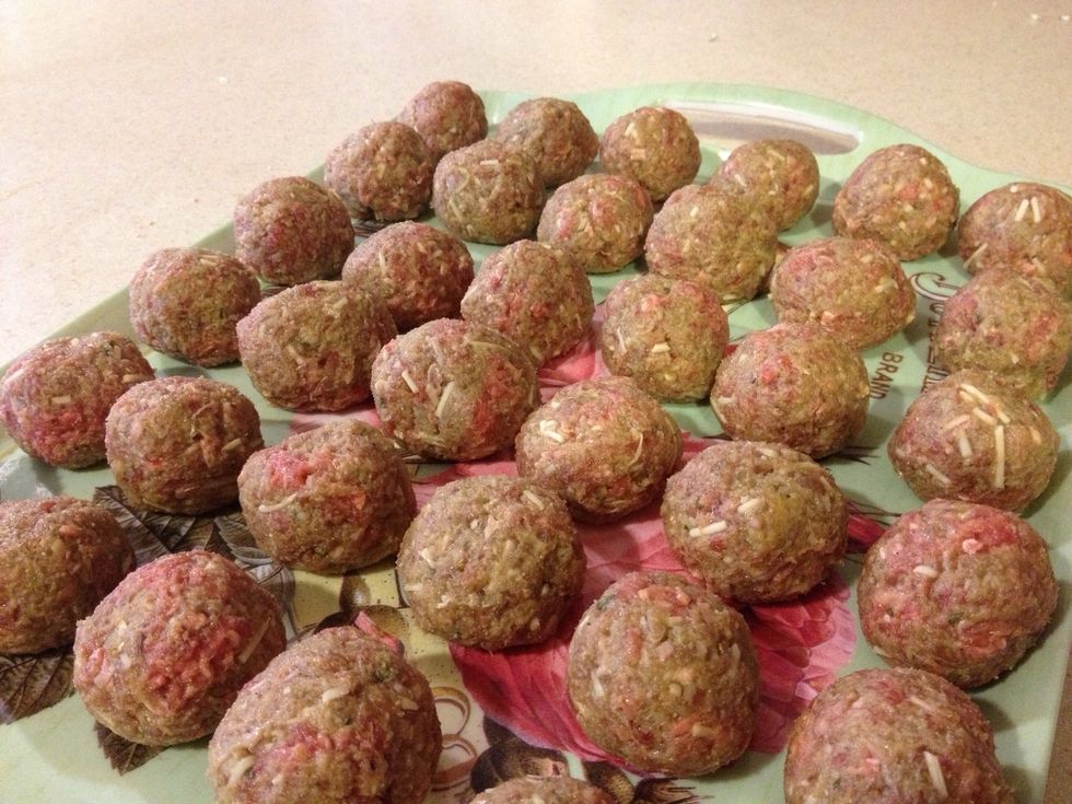 Roll into ~30 golf-ball-sized meatballs. An ice cream scoop works well for uniformity, but make sure to wash it (and everything else) very well to prevent disease.