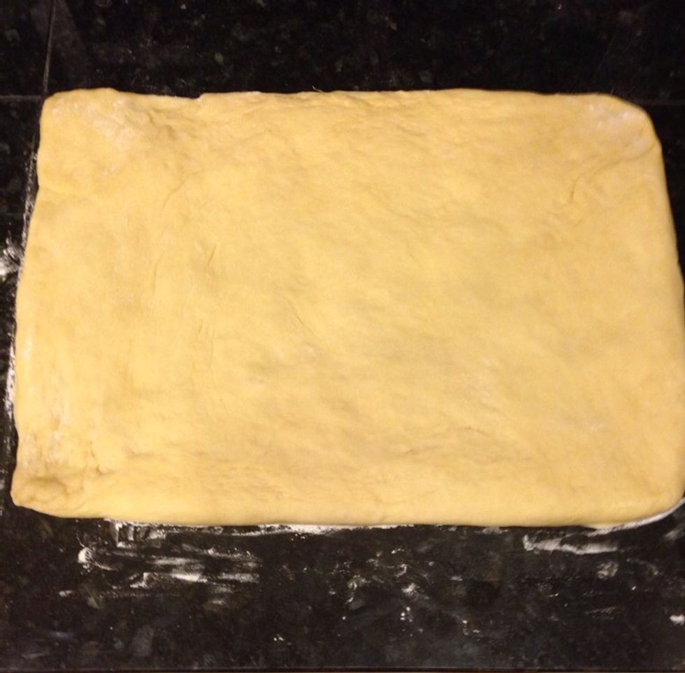 Roll into a 10x 14 inch rectangle. Lightly brush the far edge with water.