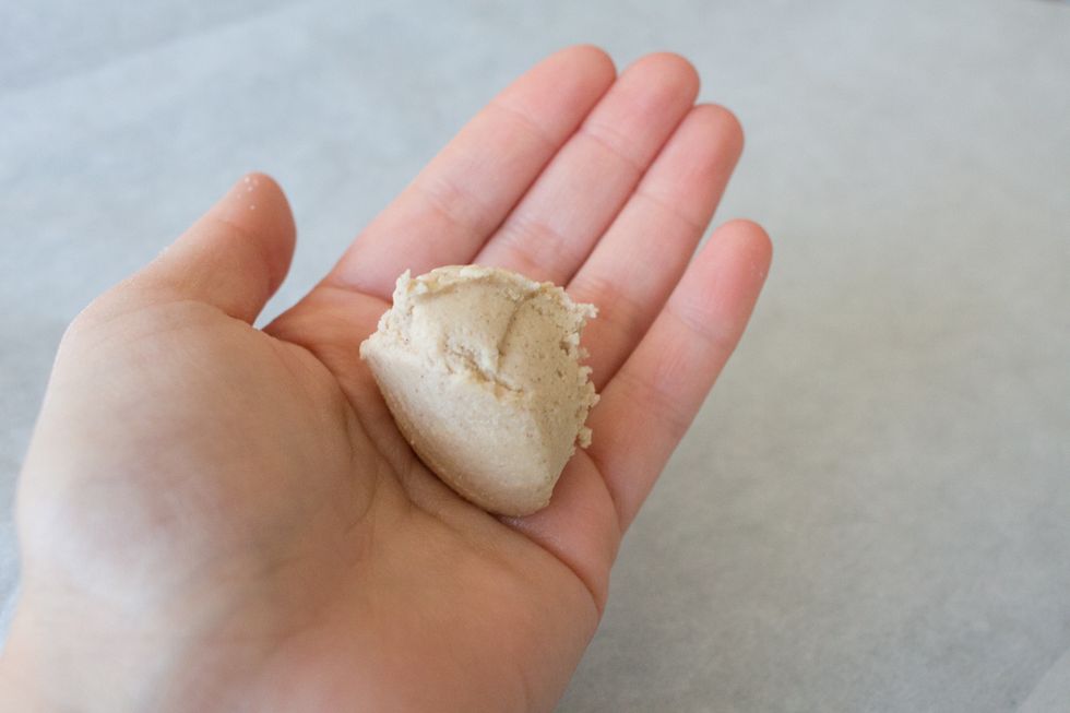 Roll into a ball and place onto a cookie sheet lined with parchment paper.