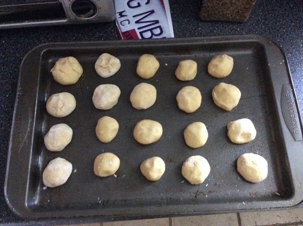 Roll it into balls and lay them on the pan until the oven is done preheating.