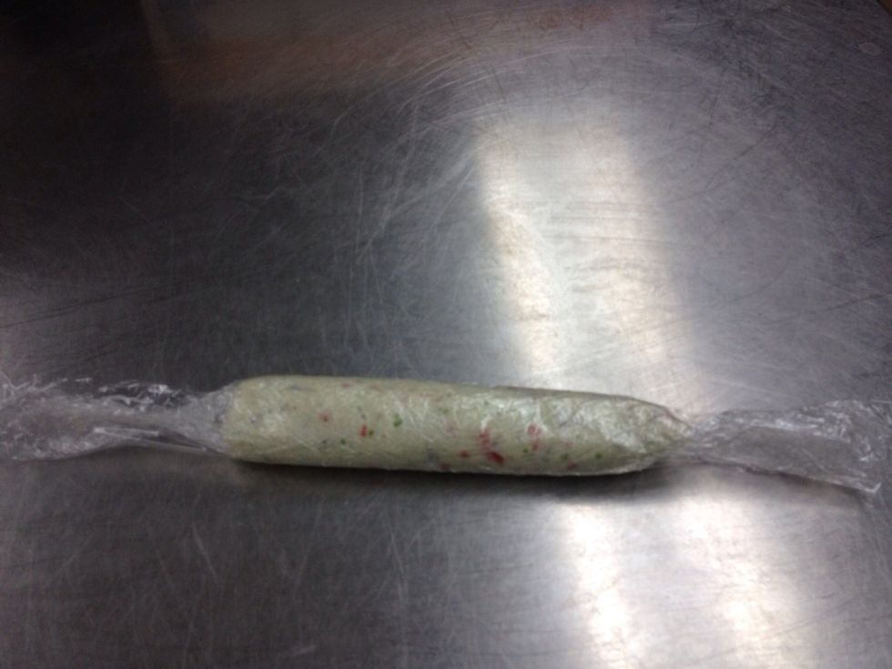 Roll mousse in plastic to form a cylinder.