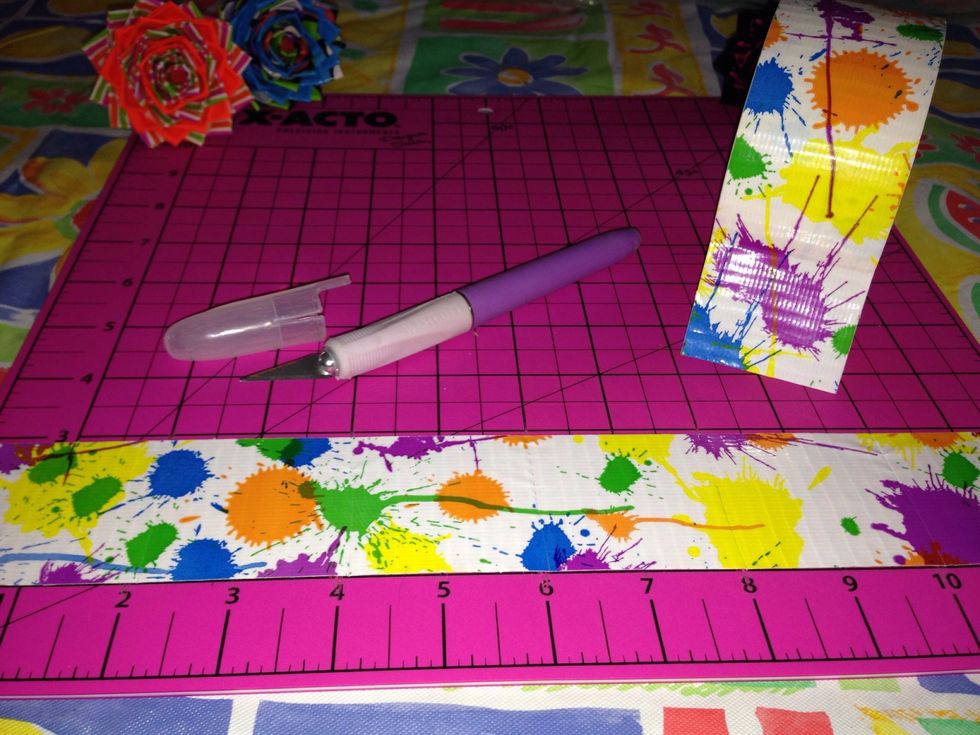 Roll out 12 inches of duct tape and cut it into 2in pieces. You'll have 6 pieces.