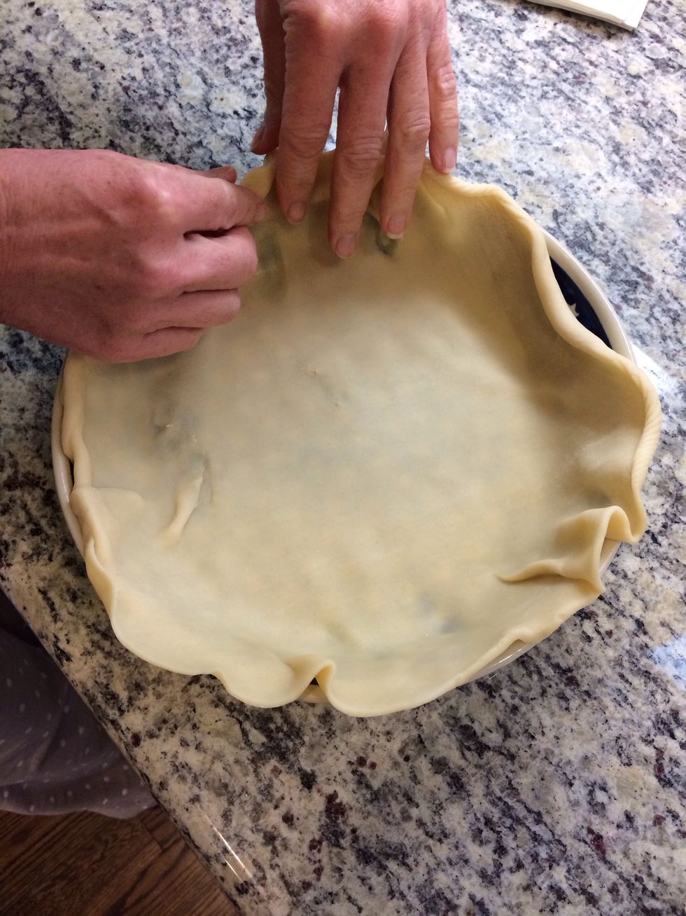 Roll out a pie crust in a pie pan.
