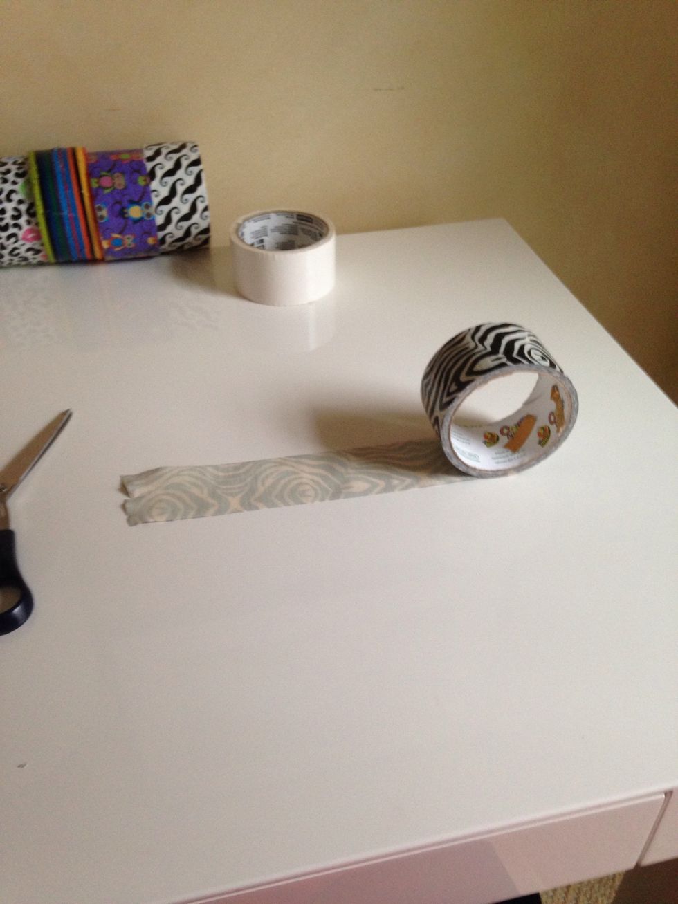 Roll out a piece of tape, the longer the tape the bigger the wallet.