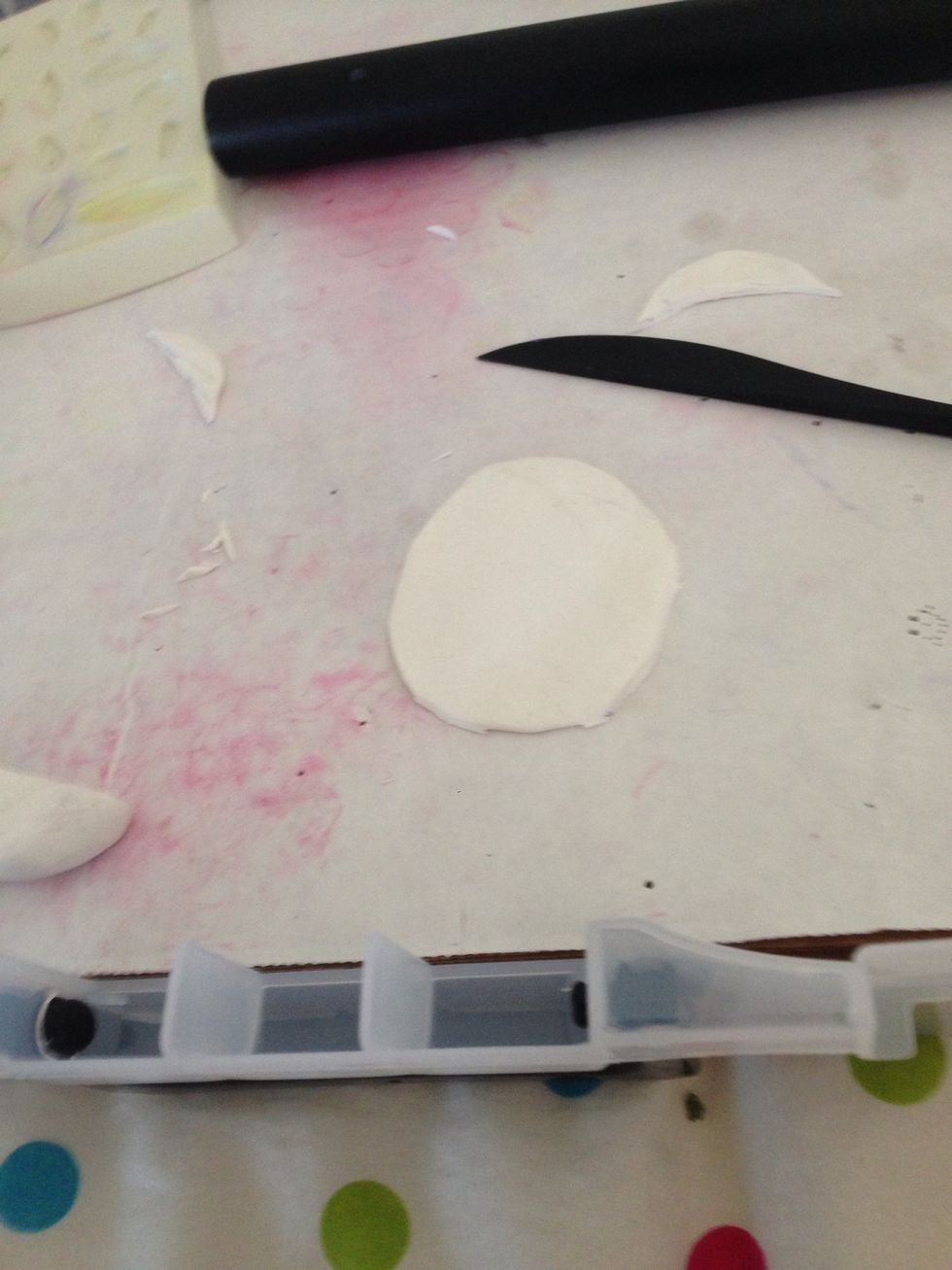 Roll out and cut off uneven edges so that it's a circle.