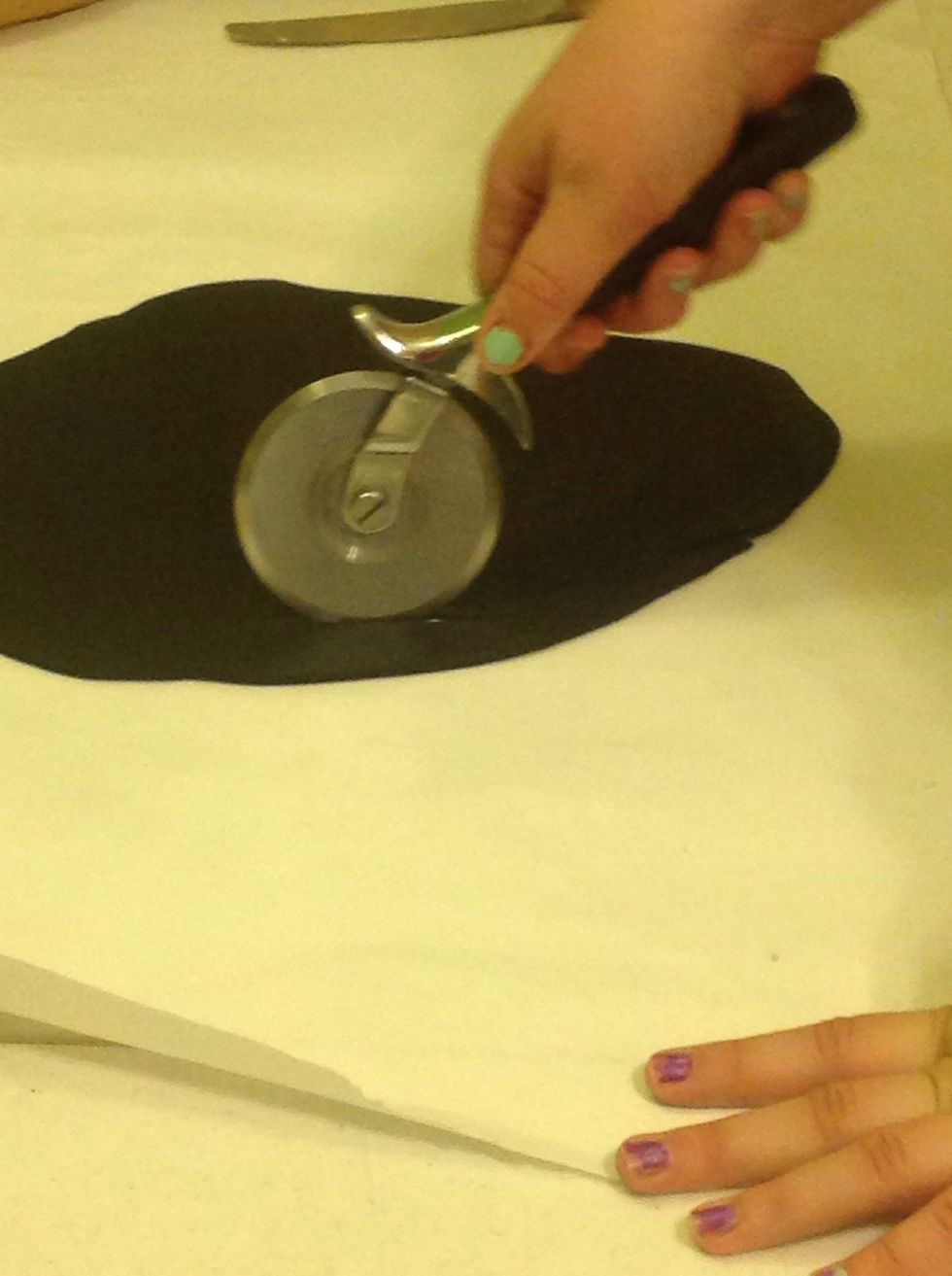 Roll out black fondant and use a pizza cutter to create zebra stripes.