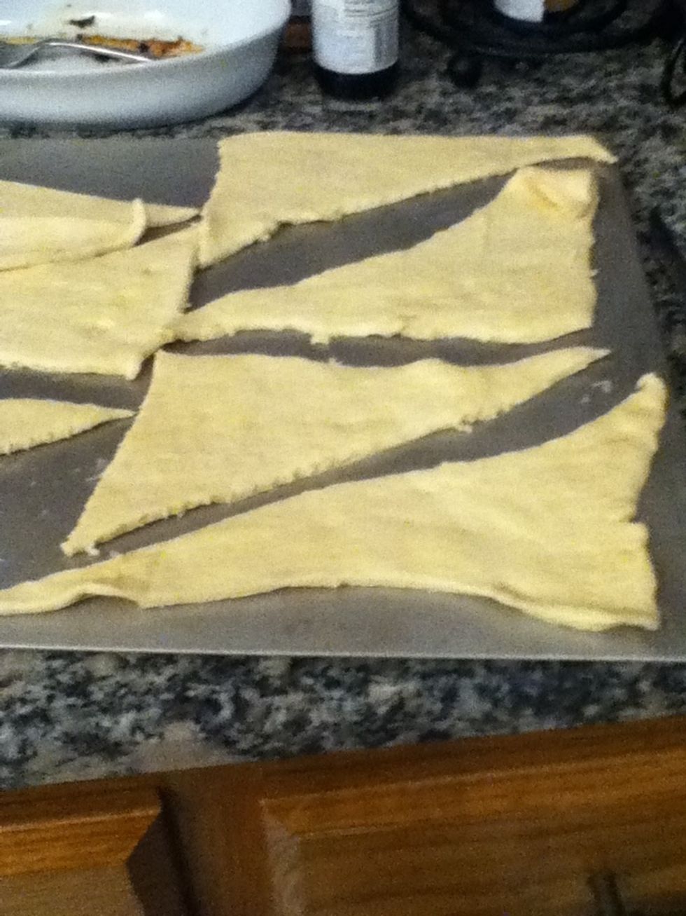 Roll out dough and cut into triangles