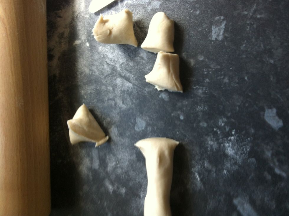 Roll out dough and cut out small pieces