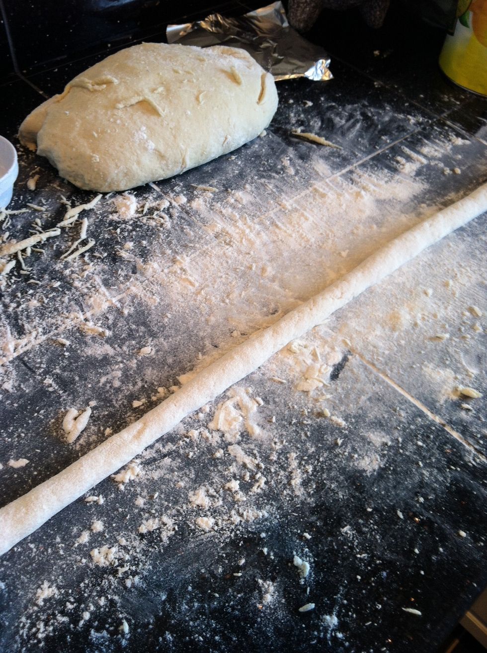 Roll out dough with hands till long finger width tube is made