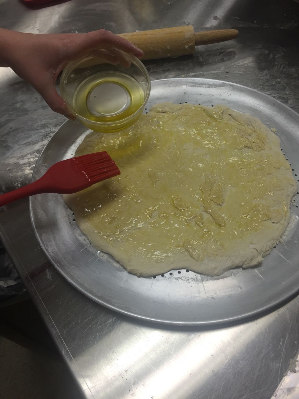 roll out into a pizza crust shape and brush with olive oil
