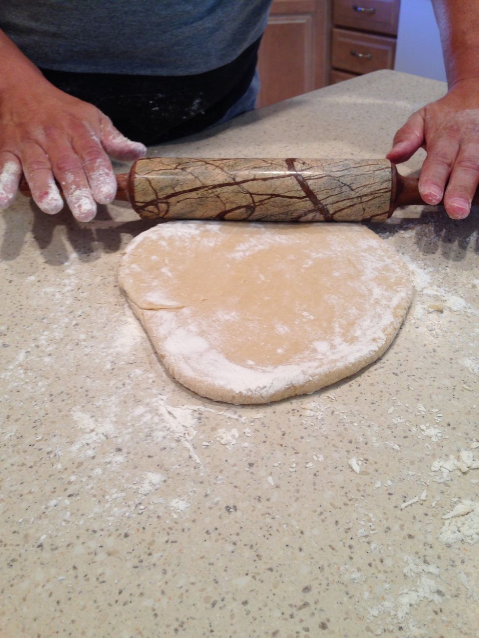 Roll out one ball of dough until it's thin. ***Keep the rolling pin and area well floured***