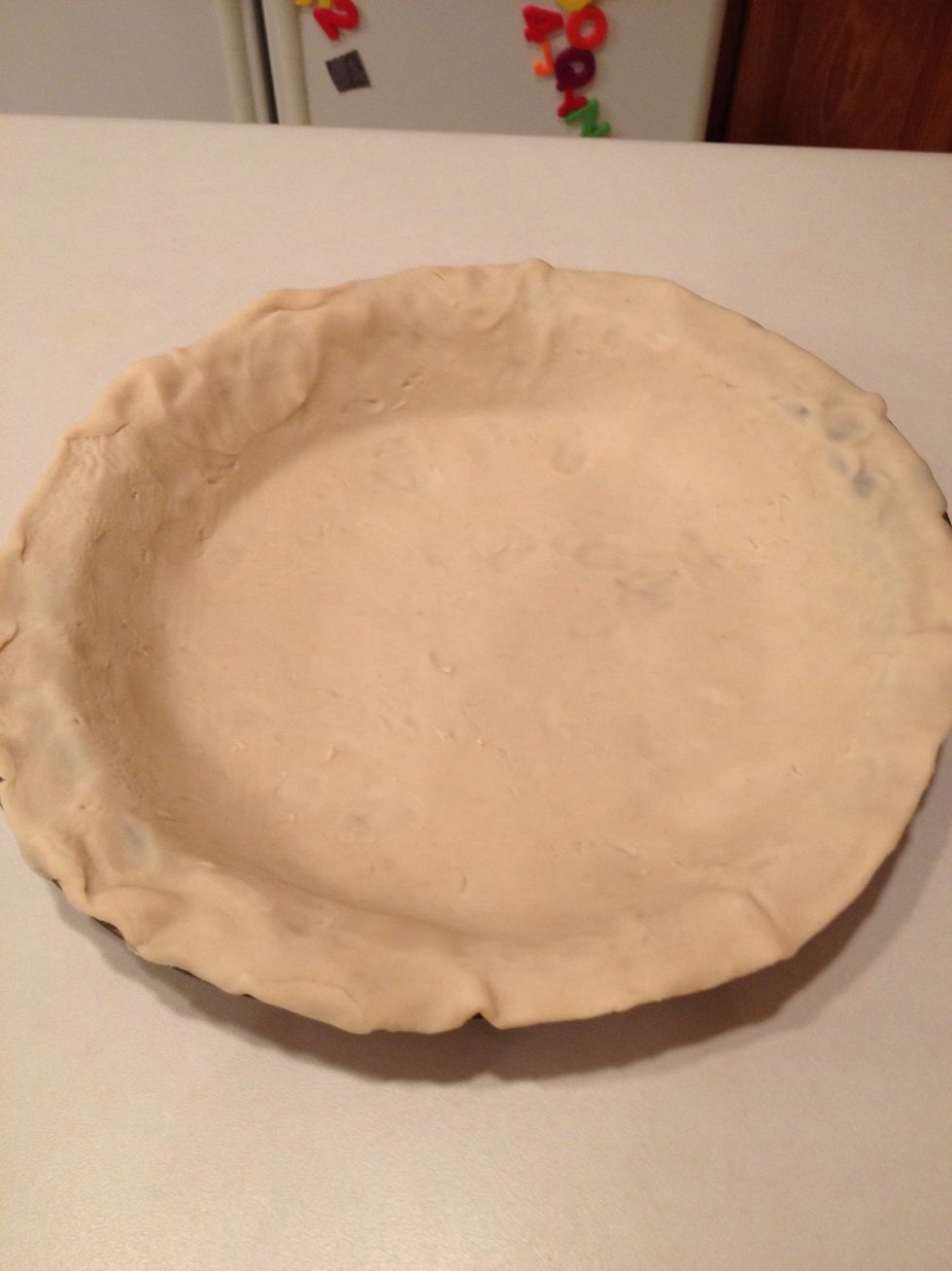 Roll out one pie crust in a pie pan.