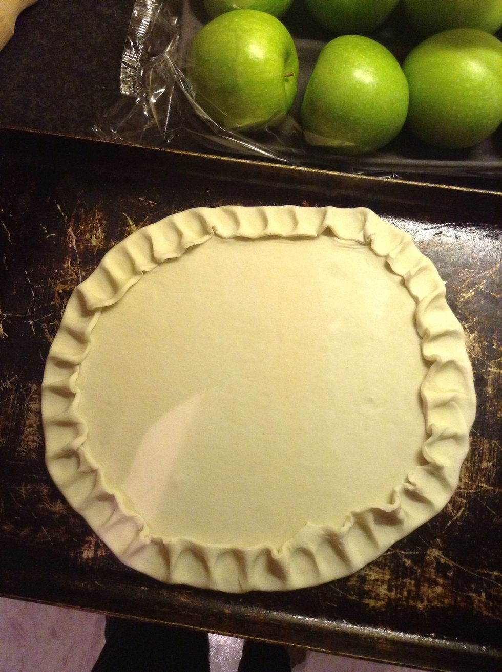 Roll out one sheet of puff pastry, use a dinner plate as a size guide, cut around the outside then crimp the edges.