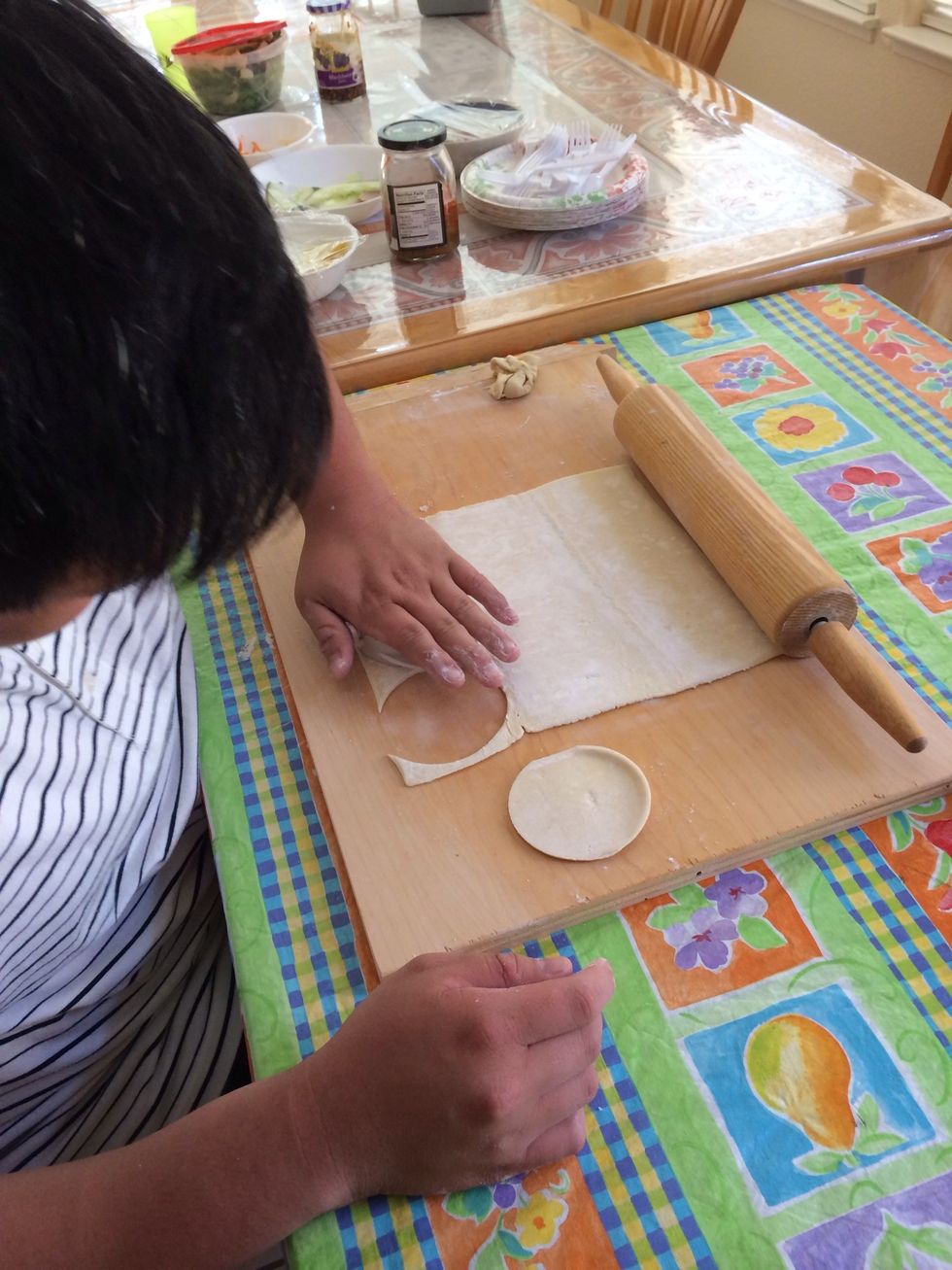 Roll out puff pastry and cut into circles using cup or tin