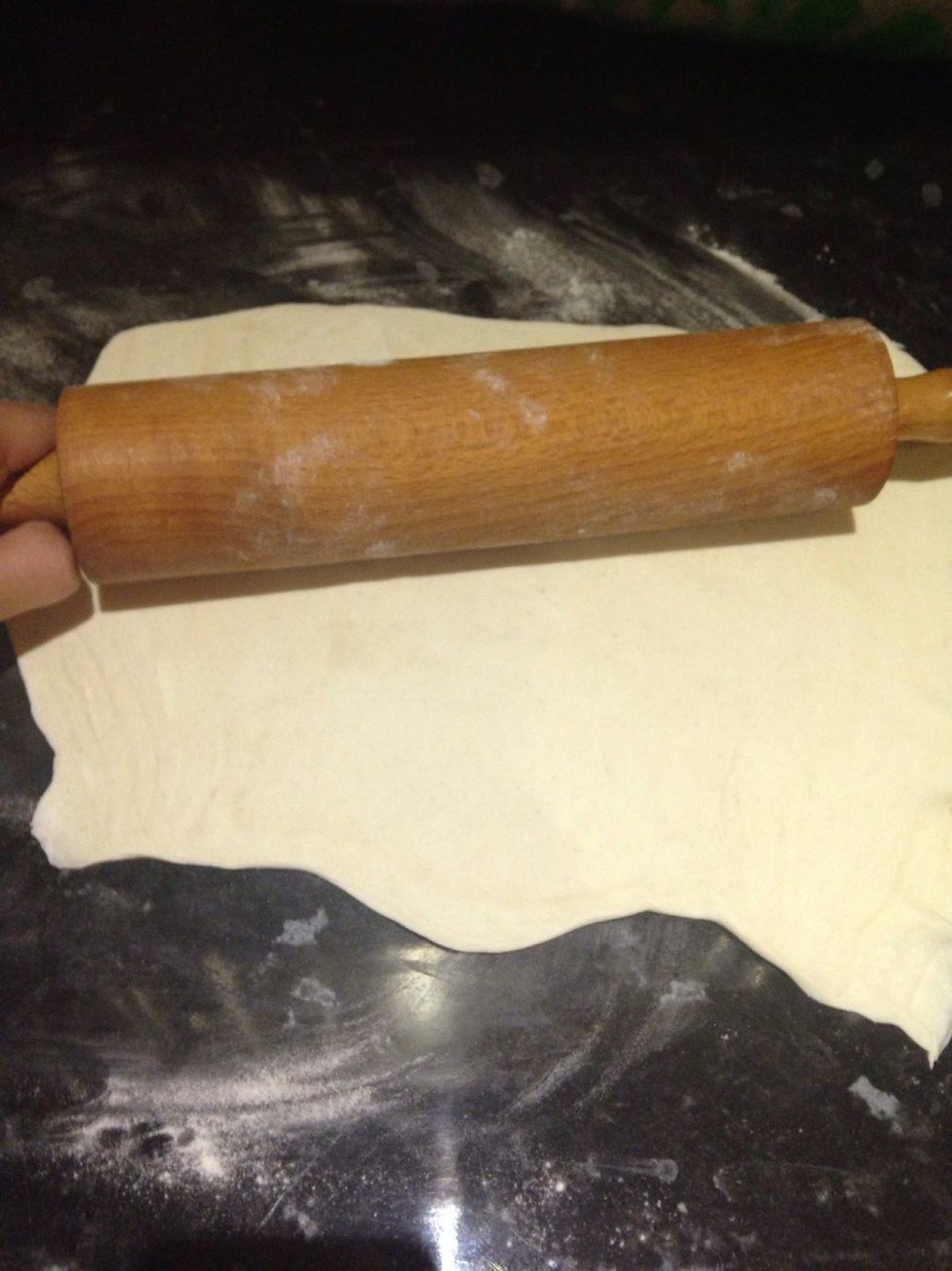 Roll out some puff pastry so it's around 1cm thick and large enough to roll into a log. Be sure to flour the surface beforehand!