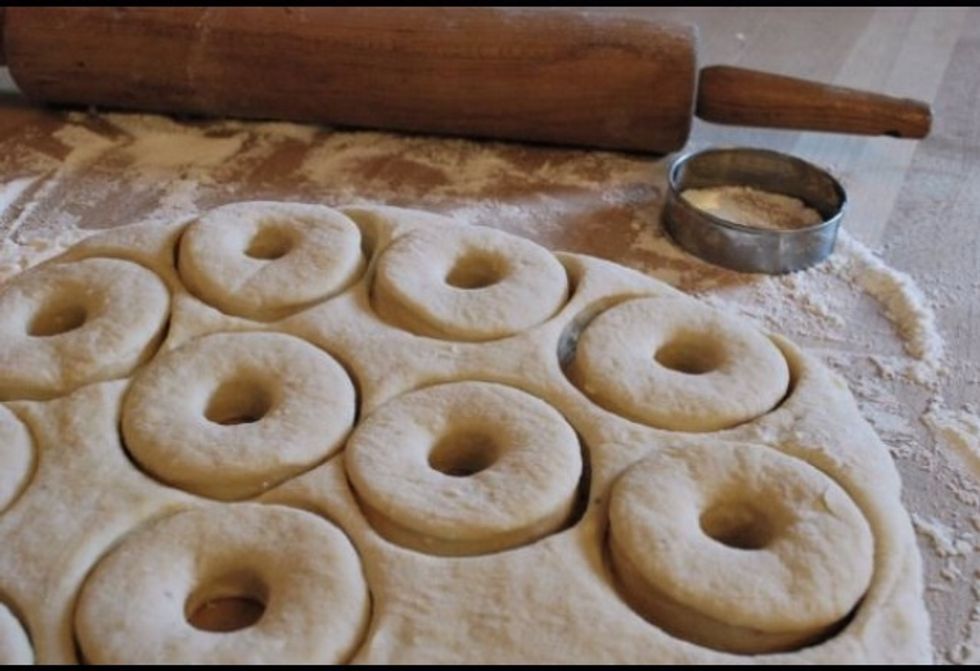 Roll out the donut dough then cut out donut shapes