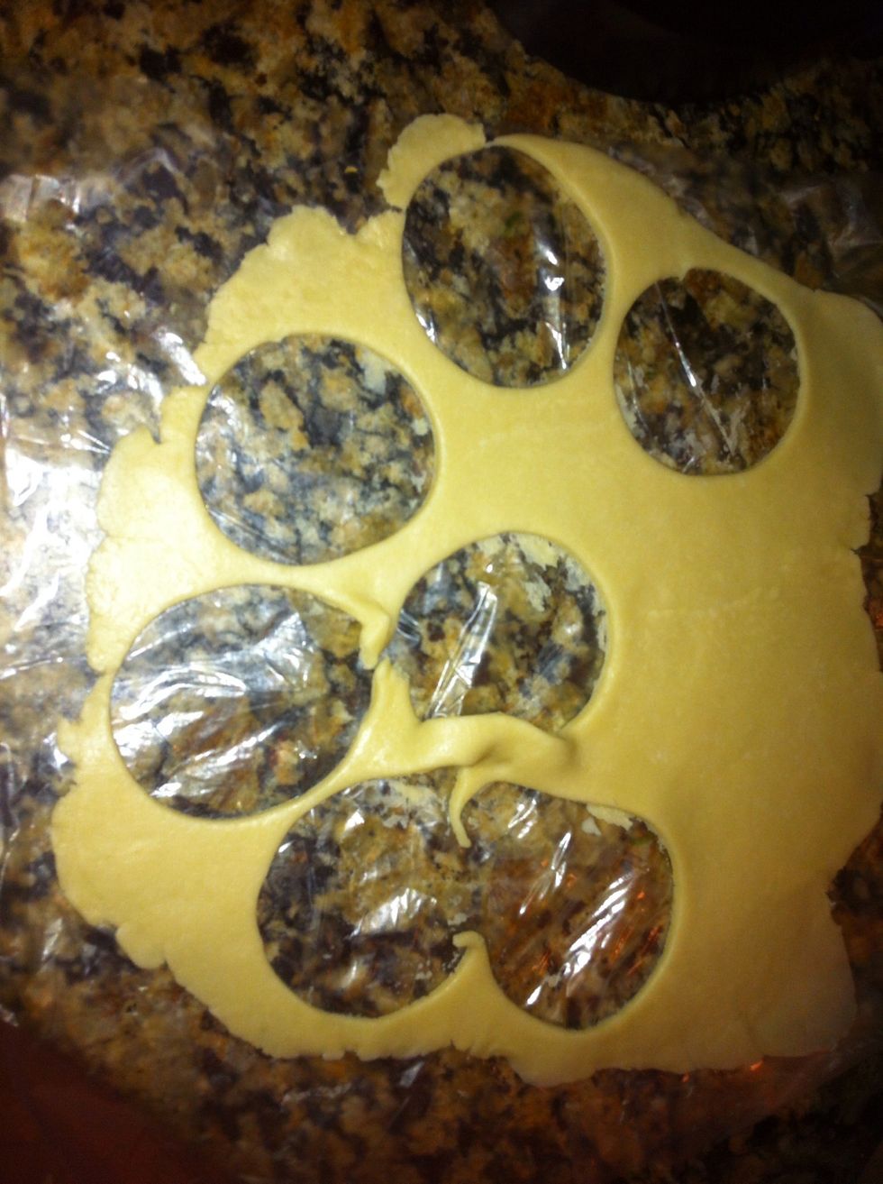 Roll out the dough and using any shape cookie cutter that you like, cut out sections o dough.