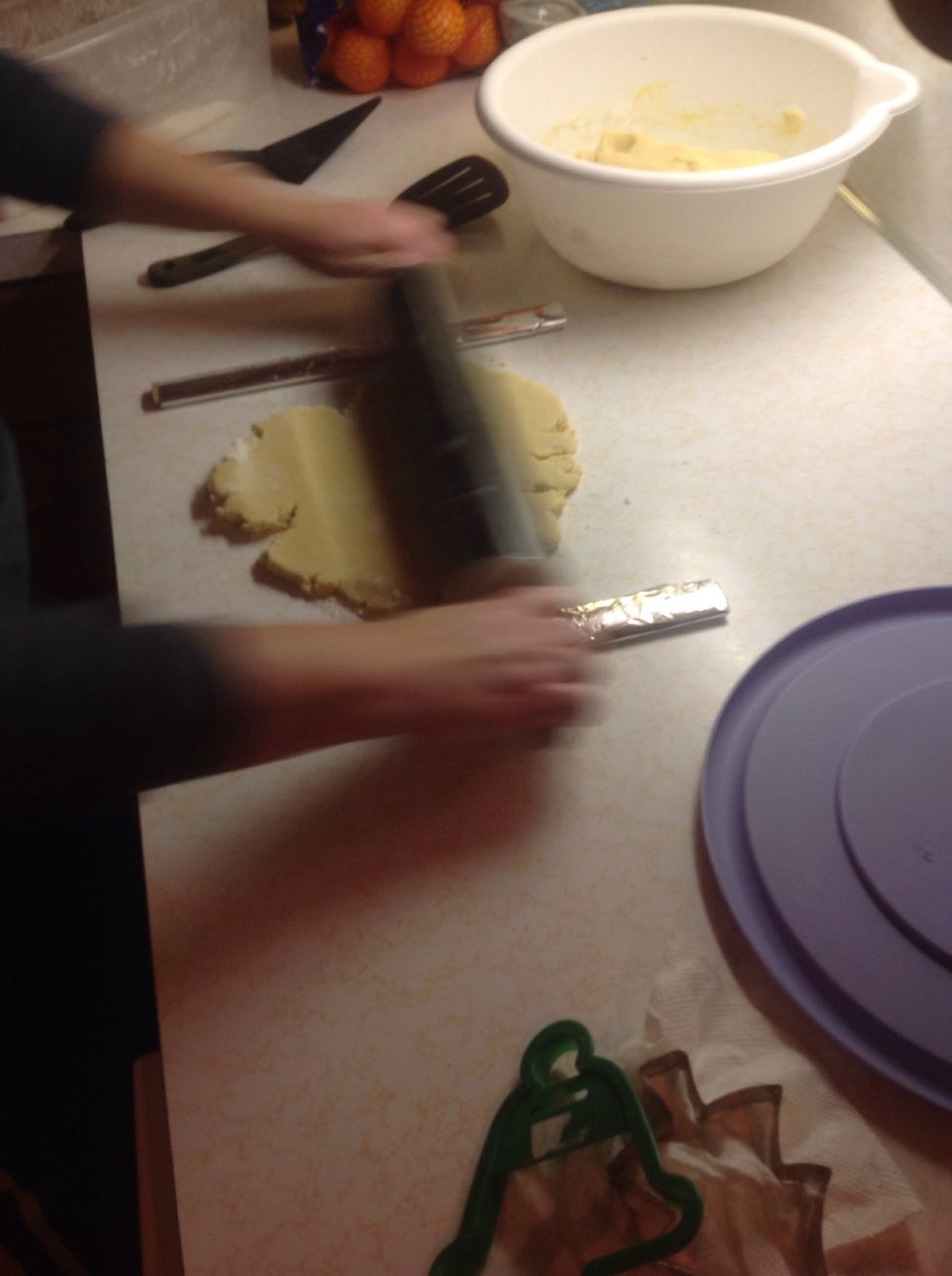 Roll out the dough, making sure the rolling pin rolls over the rulers.