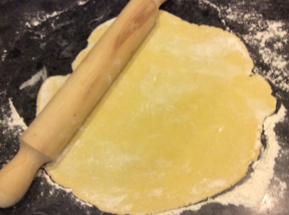 Roll out the dough on a floured surface.