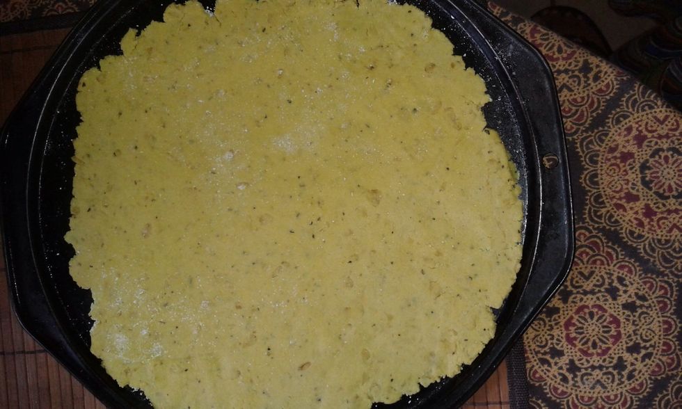 Roll out the dough onto a greased pizza tray and bake at 1medium heat for 5-8 minutes or til golden edges. Flip if you need to, but I didn't.