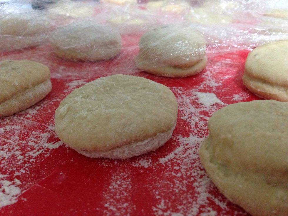 Roll out the dough to the thickness of two inches and create round shapes
