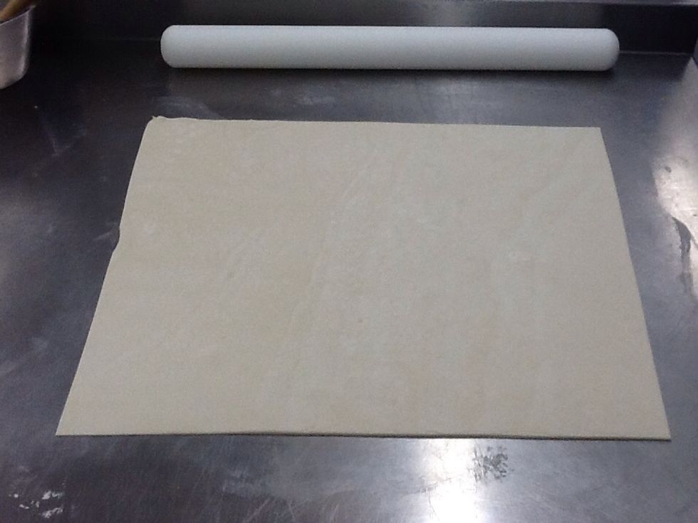 Roll out the puff pastry to about 5 millimetres. Trim and square the edges.