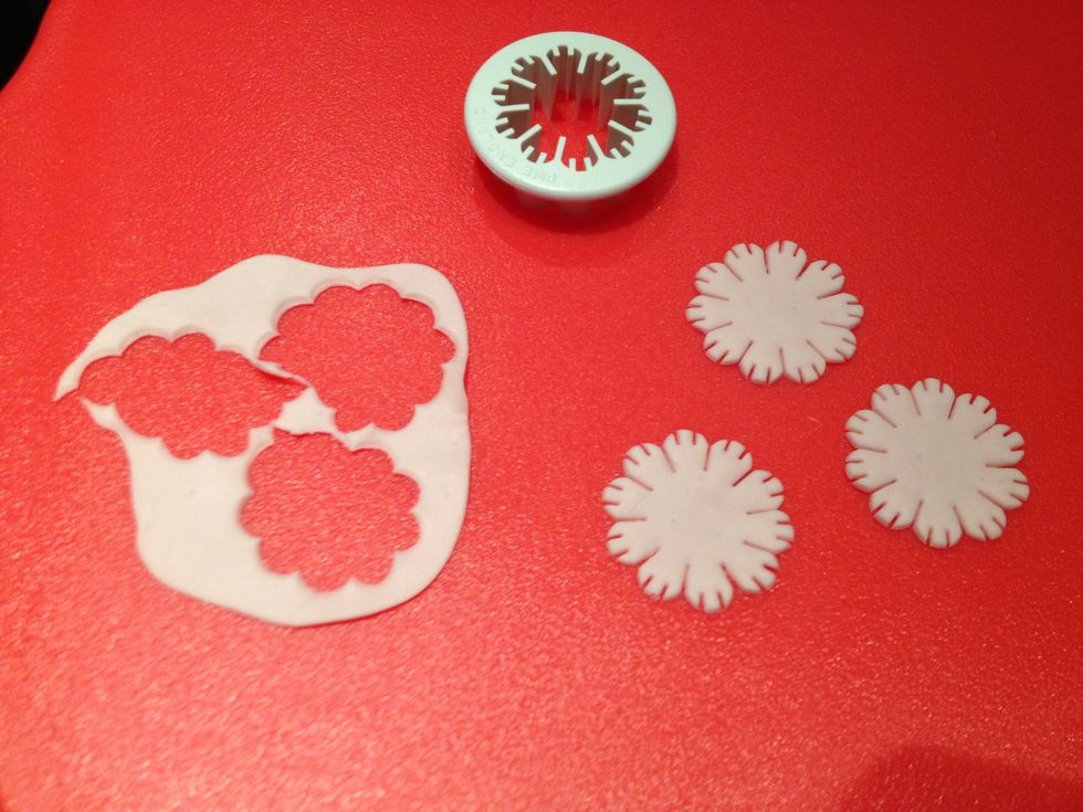 Roll out the sugar paste and cut out 3 shapes