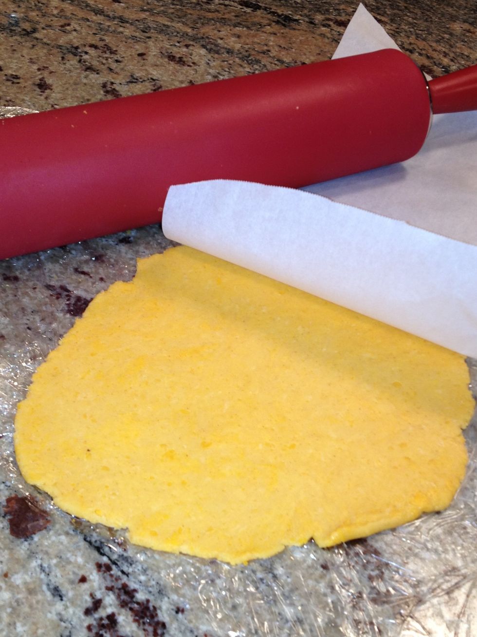 Roll out to 1/16" thick between two sheets of parchment