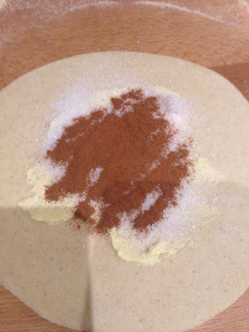 Roll out to a small ish circle and spread with softened butter. Then spread a spoonful of sugar followed by a spoonful of cinnamon