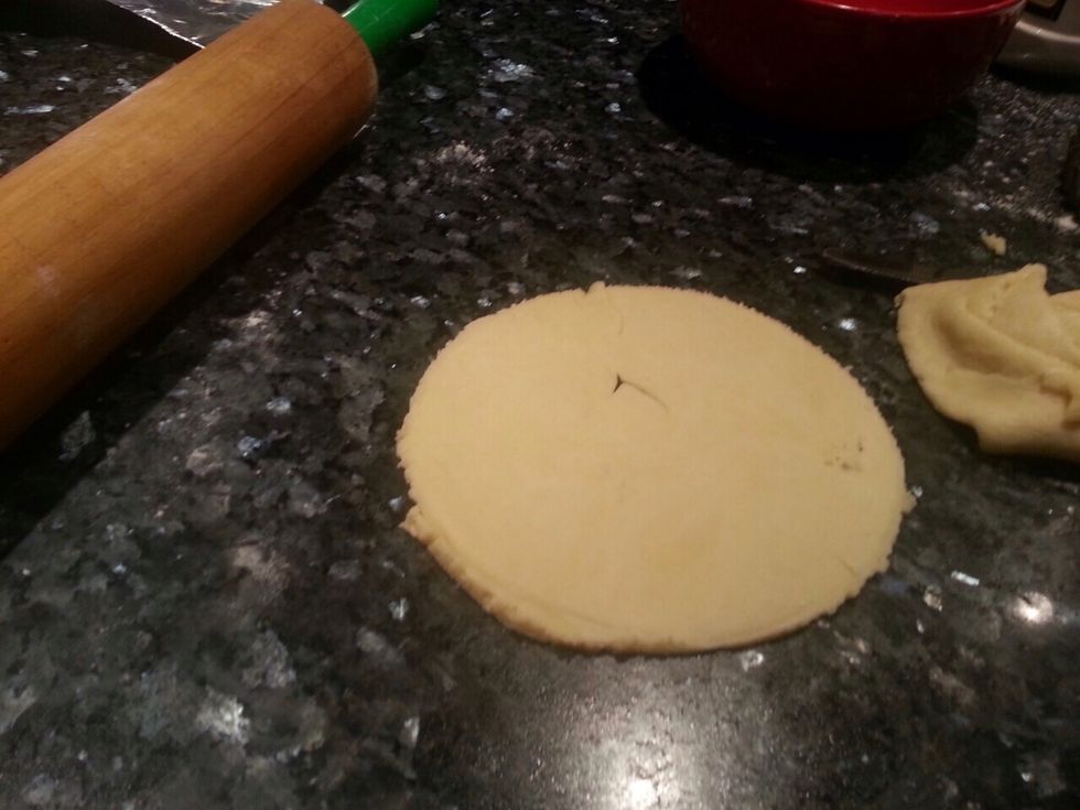 Roll out your dough and also preheat your oven at 200 degrees