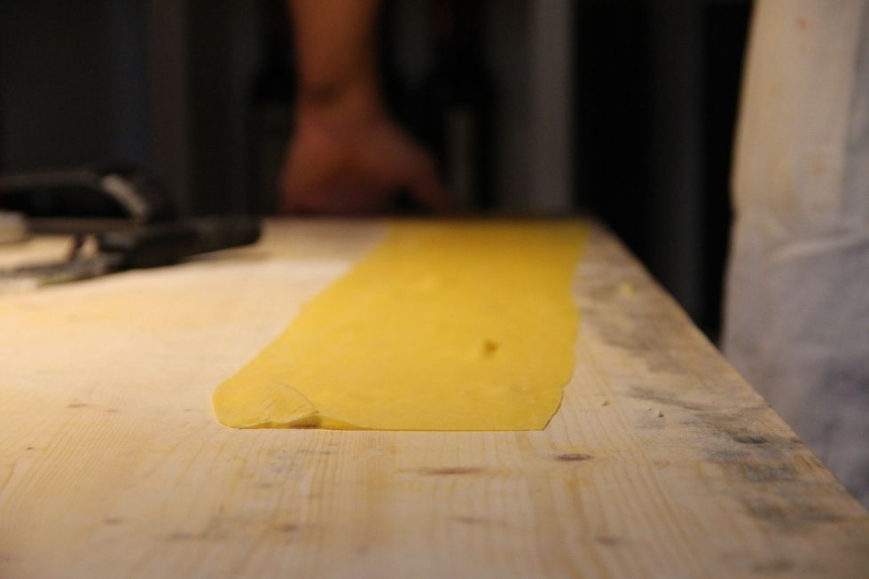 Roll out your pasta dough with a rolling pin into a long rectangular shape, careful not to roll too wide for pasta machine. If you don't have one continue to roll with pin until desired thickness.