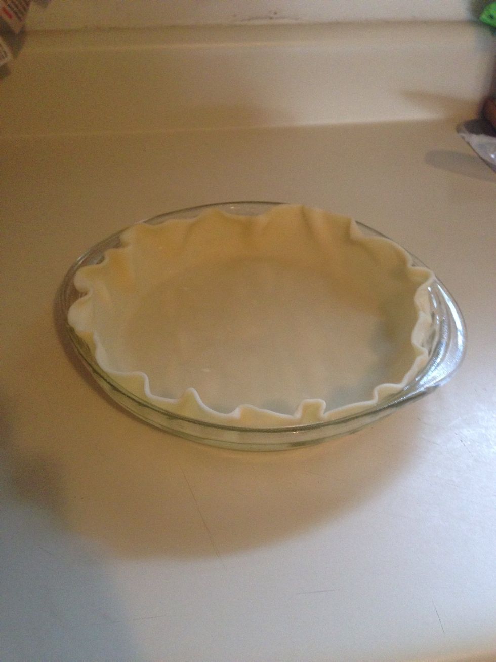 Roll out your pie crust and fit it in the plate, make sure you crimp the edges to make it look nice.