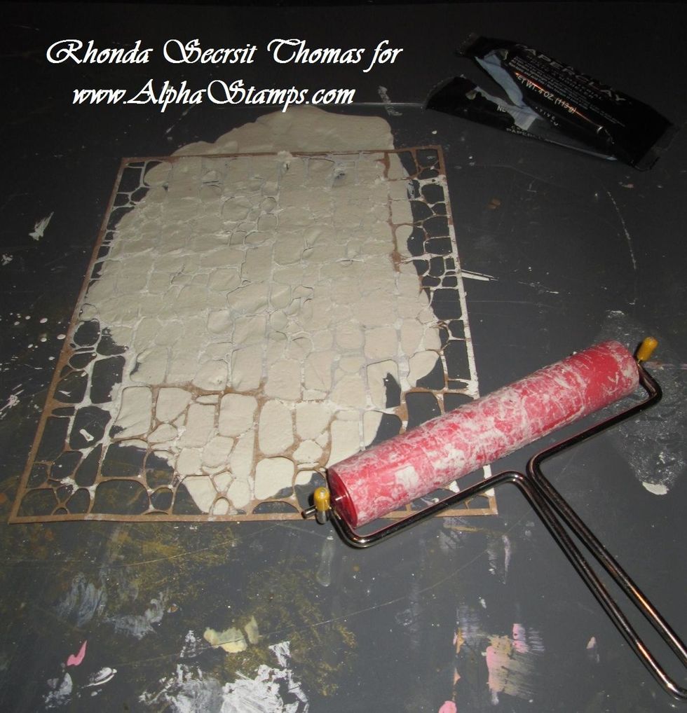 Roll over the stencil with your Brayer to make a stone or brick pattern into the Paperclay.