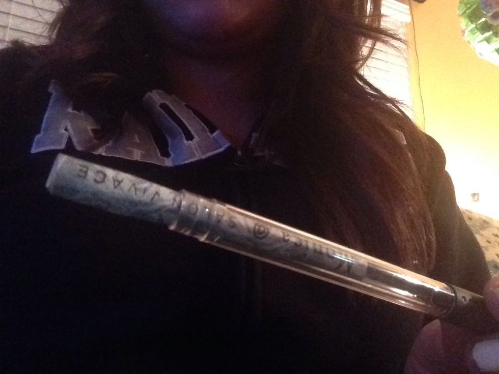 Roll paper and stick inside pen. Make sure words are facing the right way.