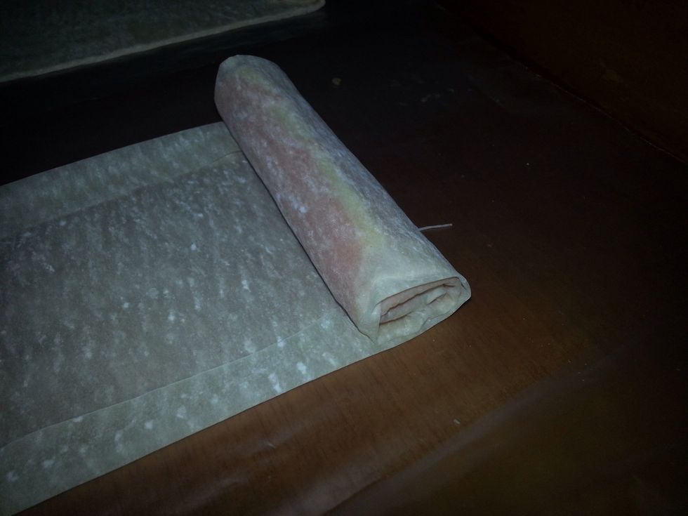 Roll pastry into a cylinder, folding in the sides as you roll to form a seal