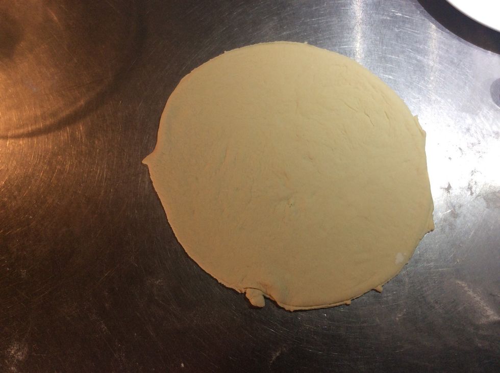 Roll pizza into a circle with rollin pin