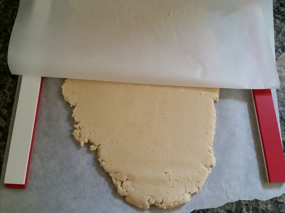 Roll sugar cookie dough 1/2" thick between two pieces of parchment paper. Place in refrigerator for 10-20 minutes to make cutting shapes easier.