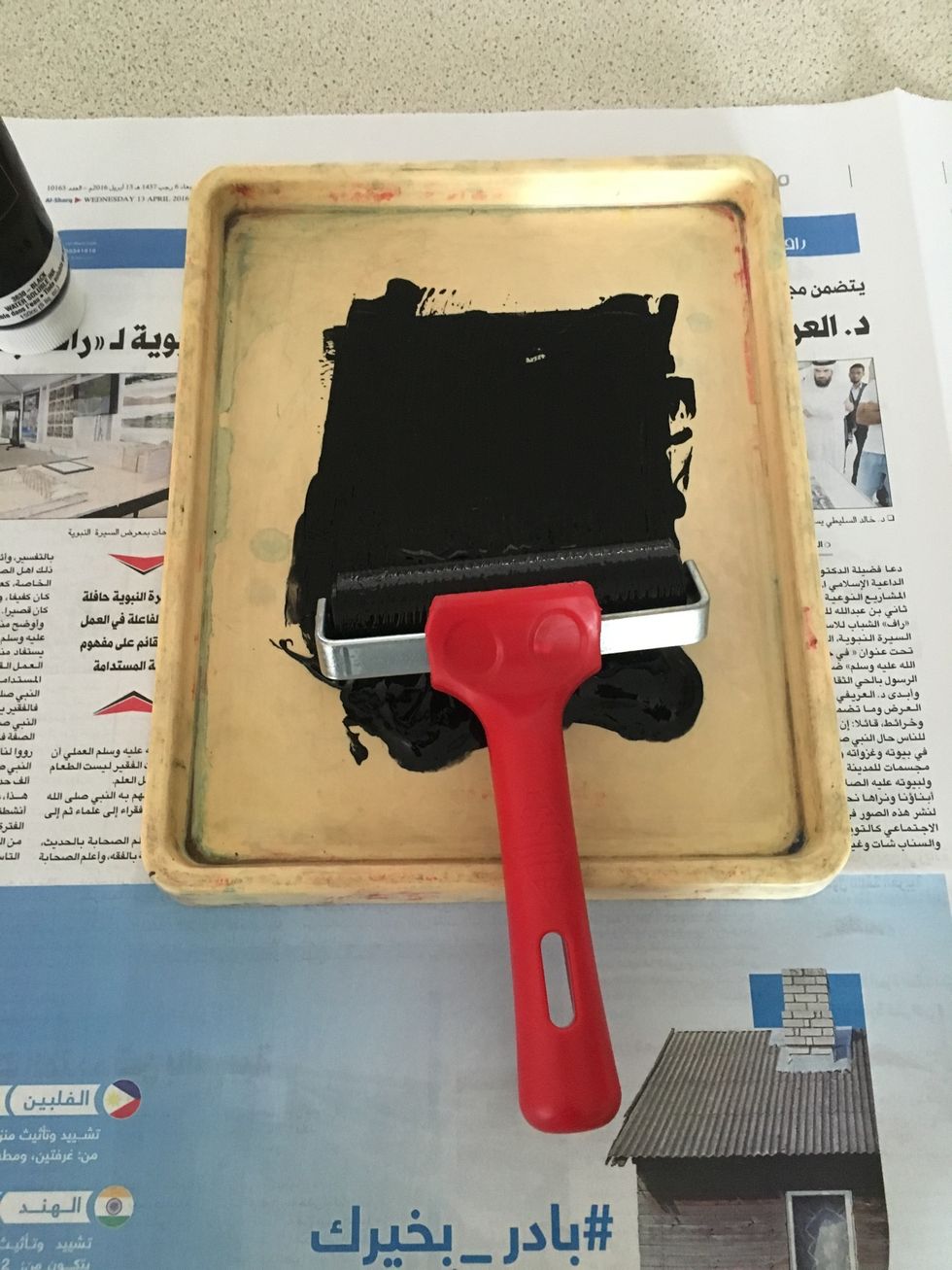 Roll the brayer in the ink up and down and side to side.