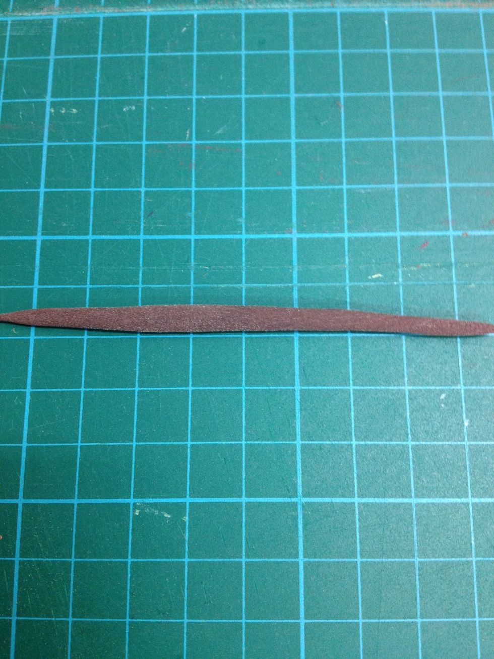 Roll the brown clay to lines.