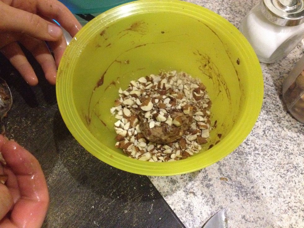 Roll the buns in chopped almonds
