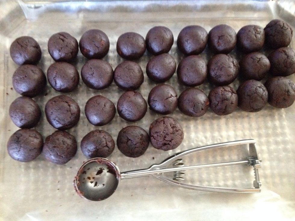 Roll the cake into ping pong size balls. You can either free hand it or use a cookie scooper to get more consistent results. Freeze the cake balls for about an hour