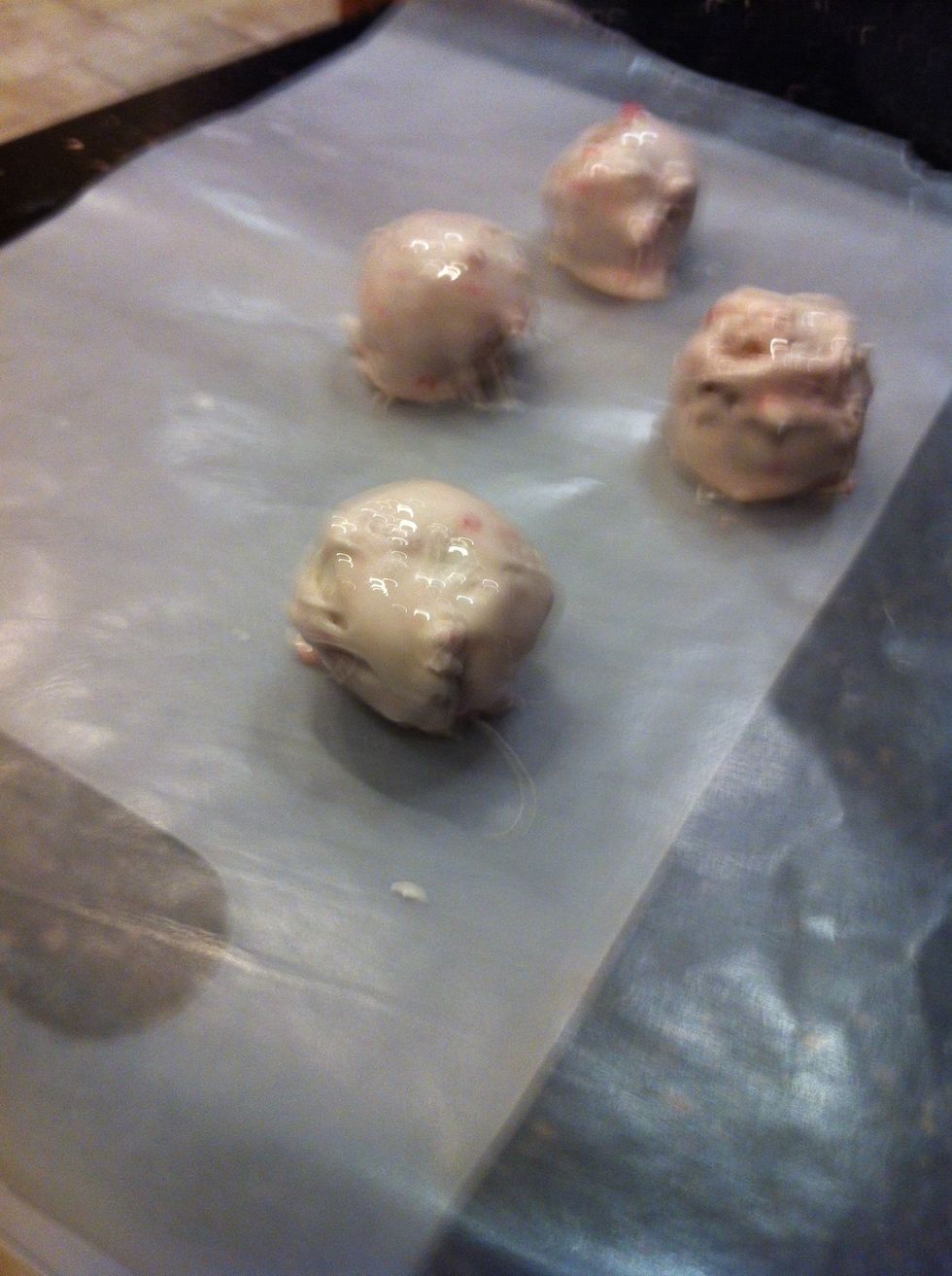 Roll the caramel balls in the melted marshmellow