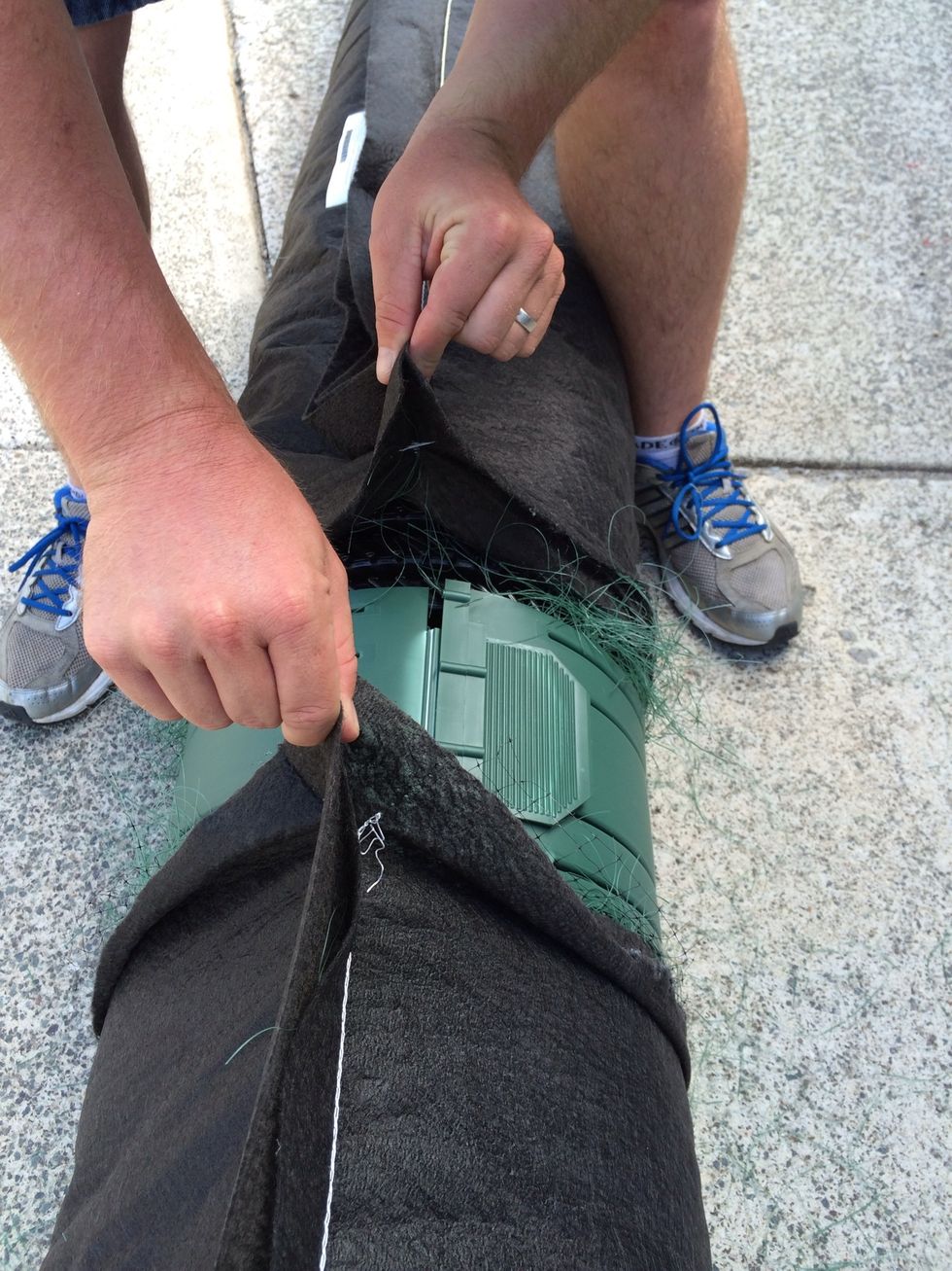 Roll the coupling around the pipe until the clip is at the top of the AES pipe inline with the seam on both pieces of pipe. The seams must be at the top to ensure bio accelerator is at the bottom.