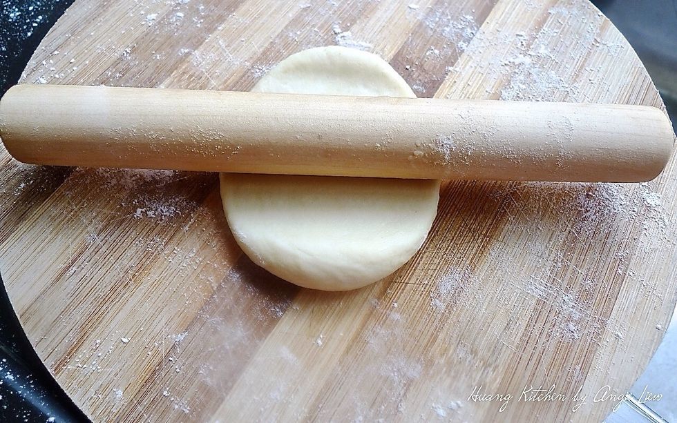 Roll the dough flat with a rolling pin.