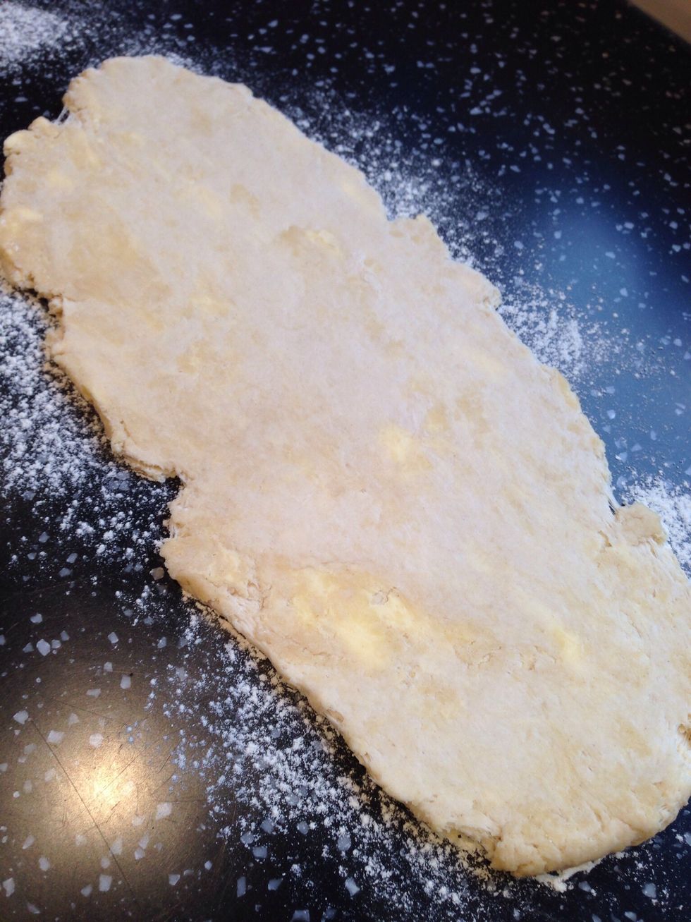 Roll the dough I to a rectangle that is roughly twice as long as it is wide. Then fold over into thirds. Rotate 90\u00b0 roll out and fold the dough two more times.